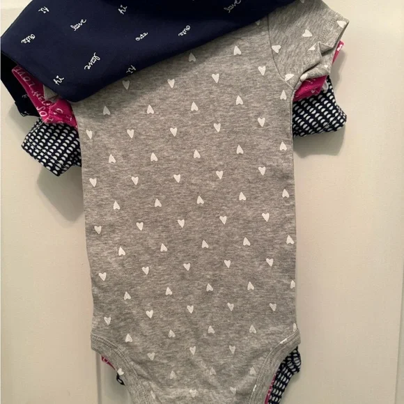 NWT set of 4 CARTER’S ONSIES. Baby Size 9 months Brand New still on hangers NEW - Picture 4 of 12